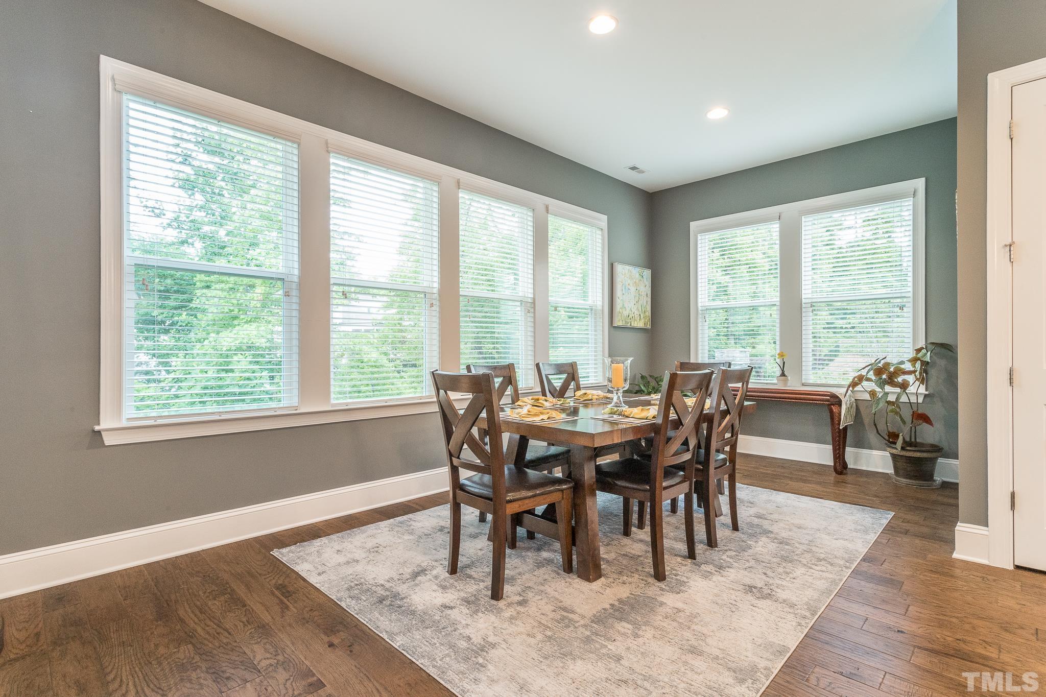 5281 Aleppo Lane Raleigh, NC 27613 - Photo 24 of 57 a view of a dining room with furniture and wooden floor