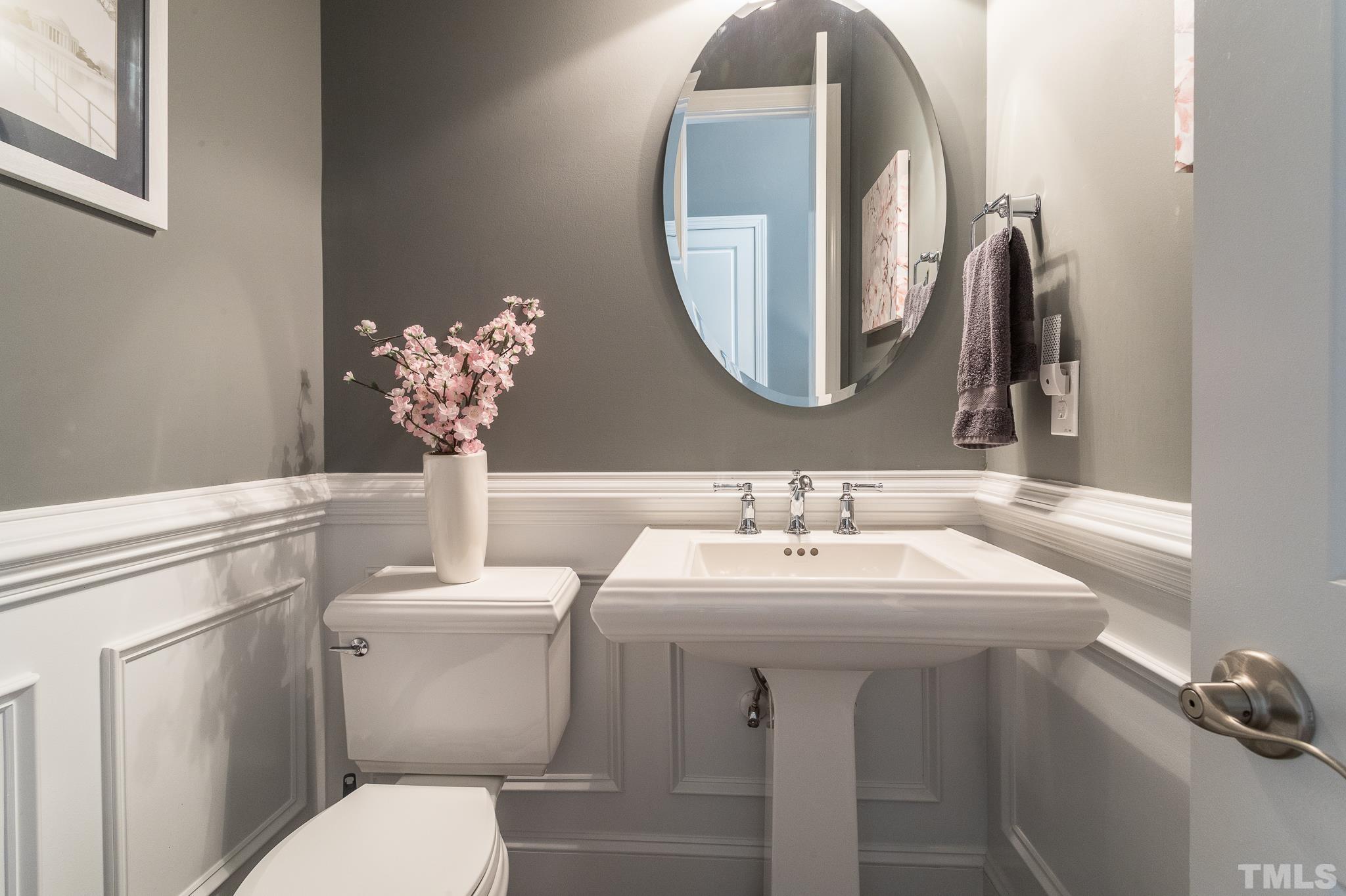 5281 Aleppo Lane Raleigh, NC 27613 - Photo 26 of 57 a bathroom with a toilet sink and mirror