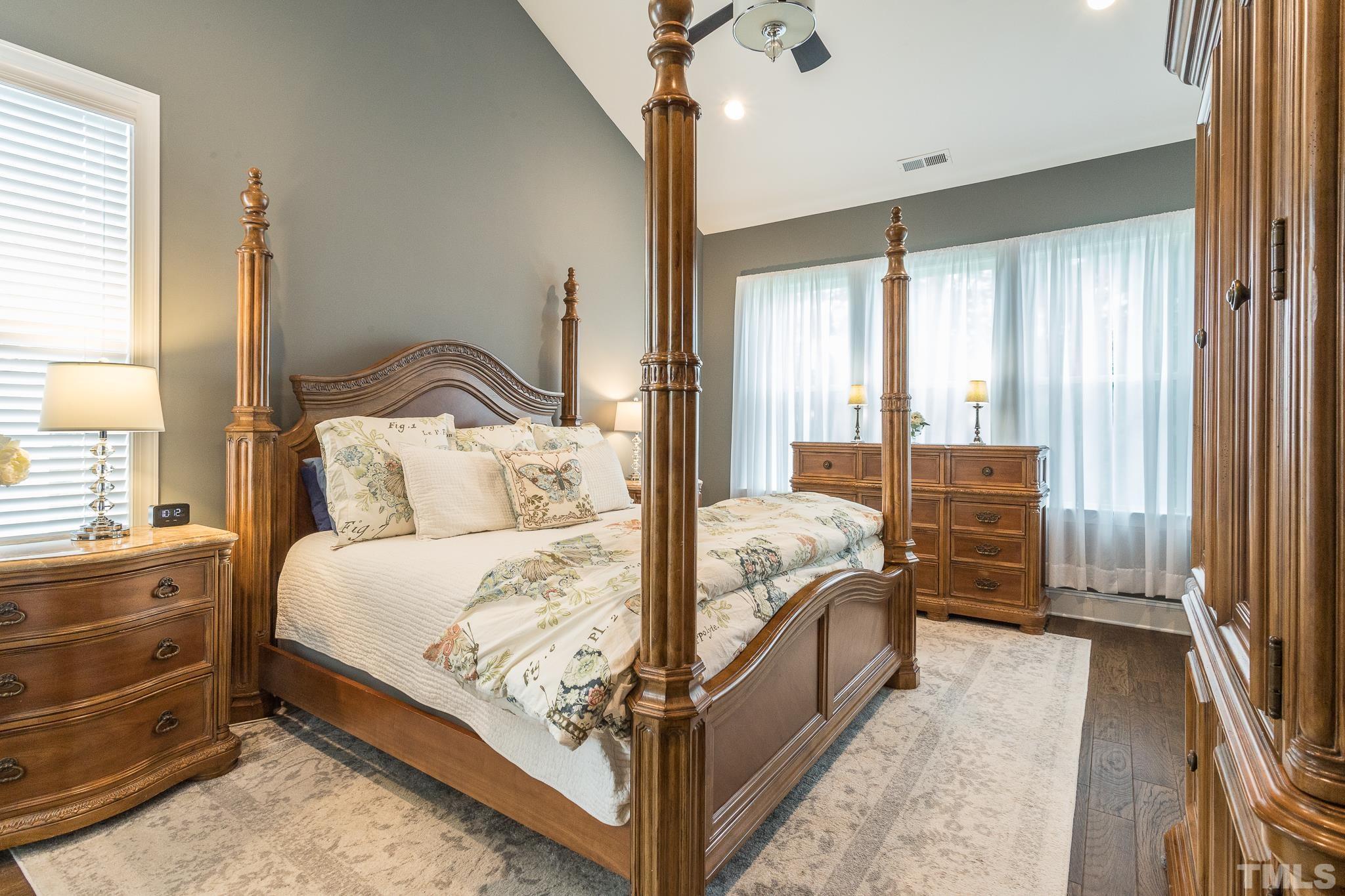 5281 Aleppo Lane Raleigh, NC 27613 - Photo 27 of 57 a bed sitting in a bedroom next to a window
