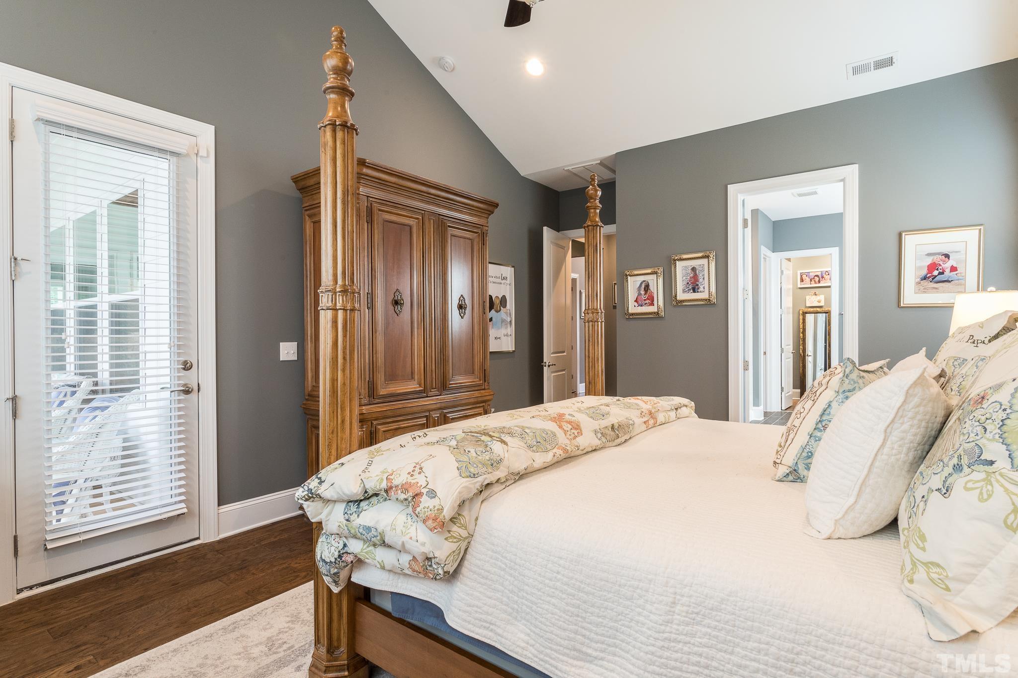 5281 Aleppo Lane Raleigh, NC 27613 - Photo 28 of 57 a bedroom with a bed and wooden floor