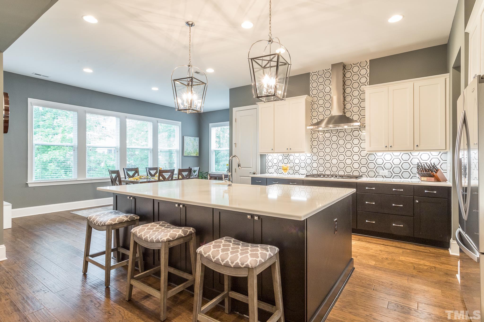 5281 Aleppo Lane Raleigh, NC 27613 - Photo 3 of 57 a large kitchen with a table and chairs in it