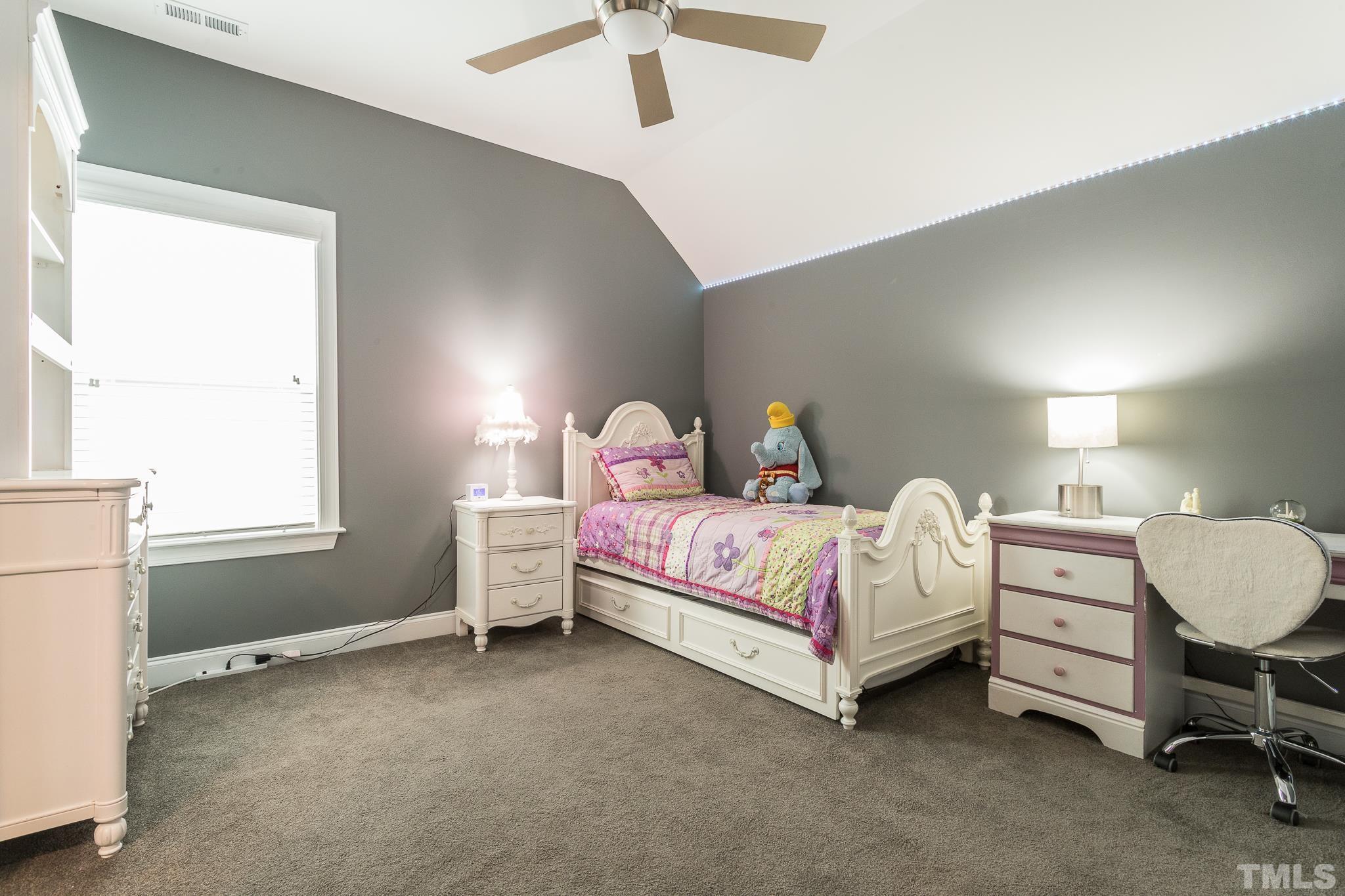 5281 Aleppo Lane Raleigh, NC 27613 - Photo 32 of 57 a bedroom with a bed dresser and a window