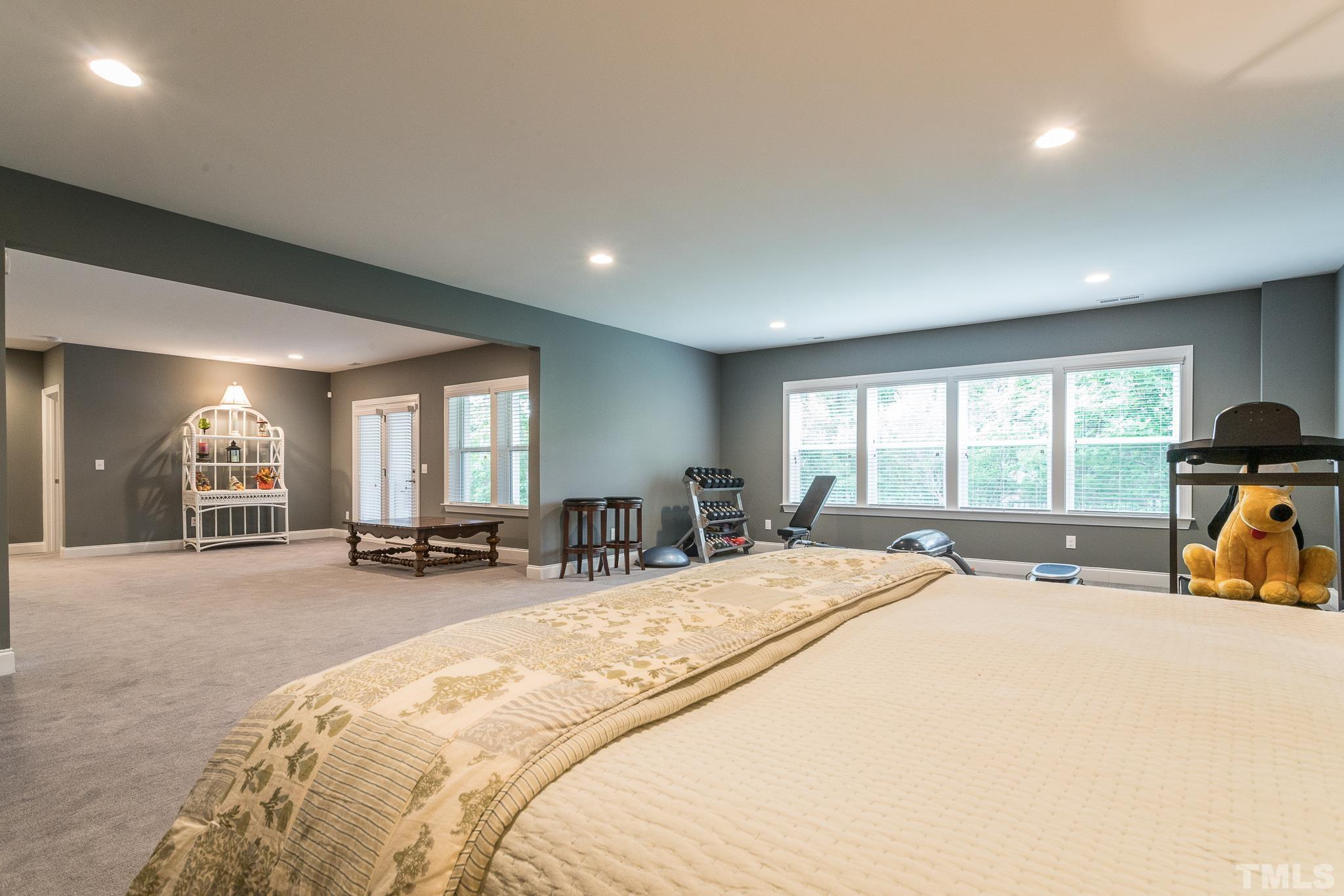5281 Aleppo Lane Raleigh, NC 27613 - Photo 41 of 57 a bed room with a bed and a large window