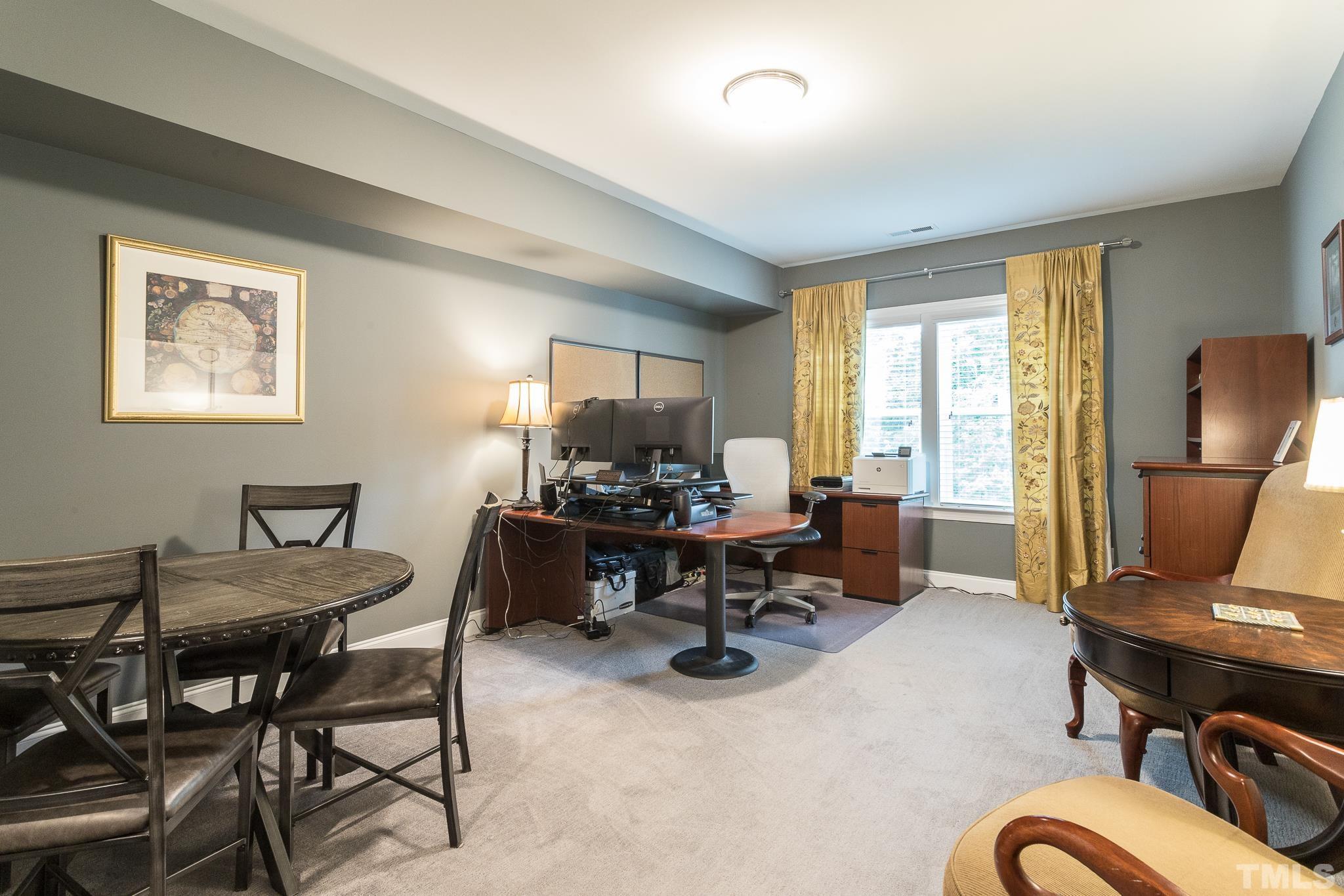 5281 Aleppo Lane Raleigh, NC 27613 - Photo 42 of 57 a view of a workspace with furniture and a window