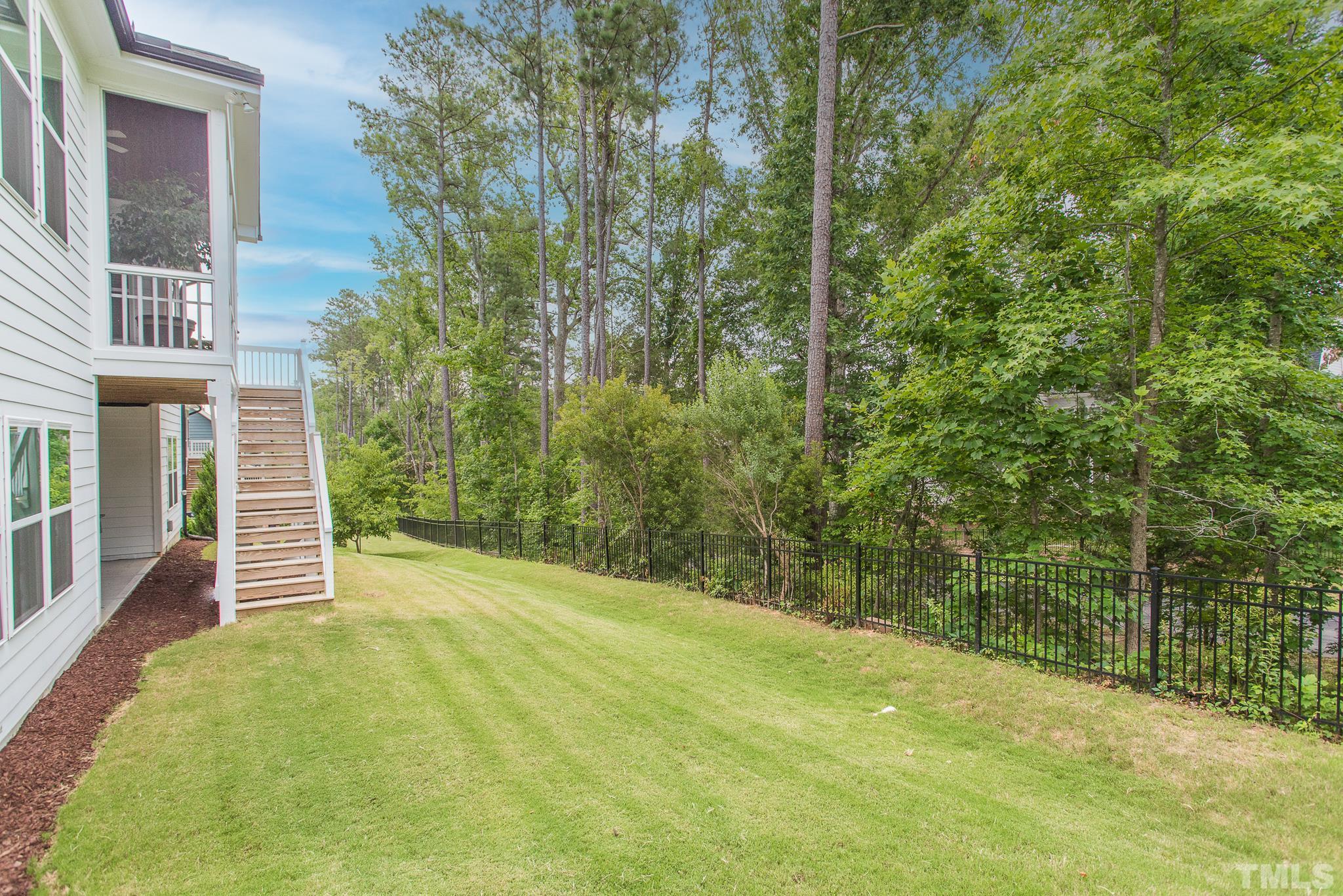 5281 Aleppo Lane Raleigh, NC 27613 - Photo 46 of 57 a view of a house with a backyard