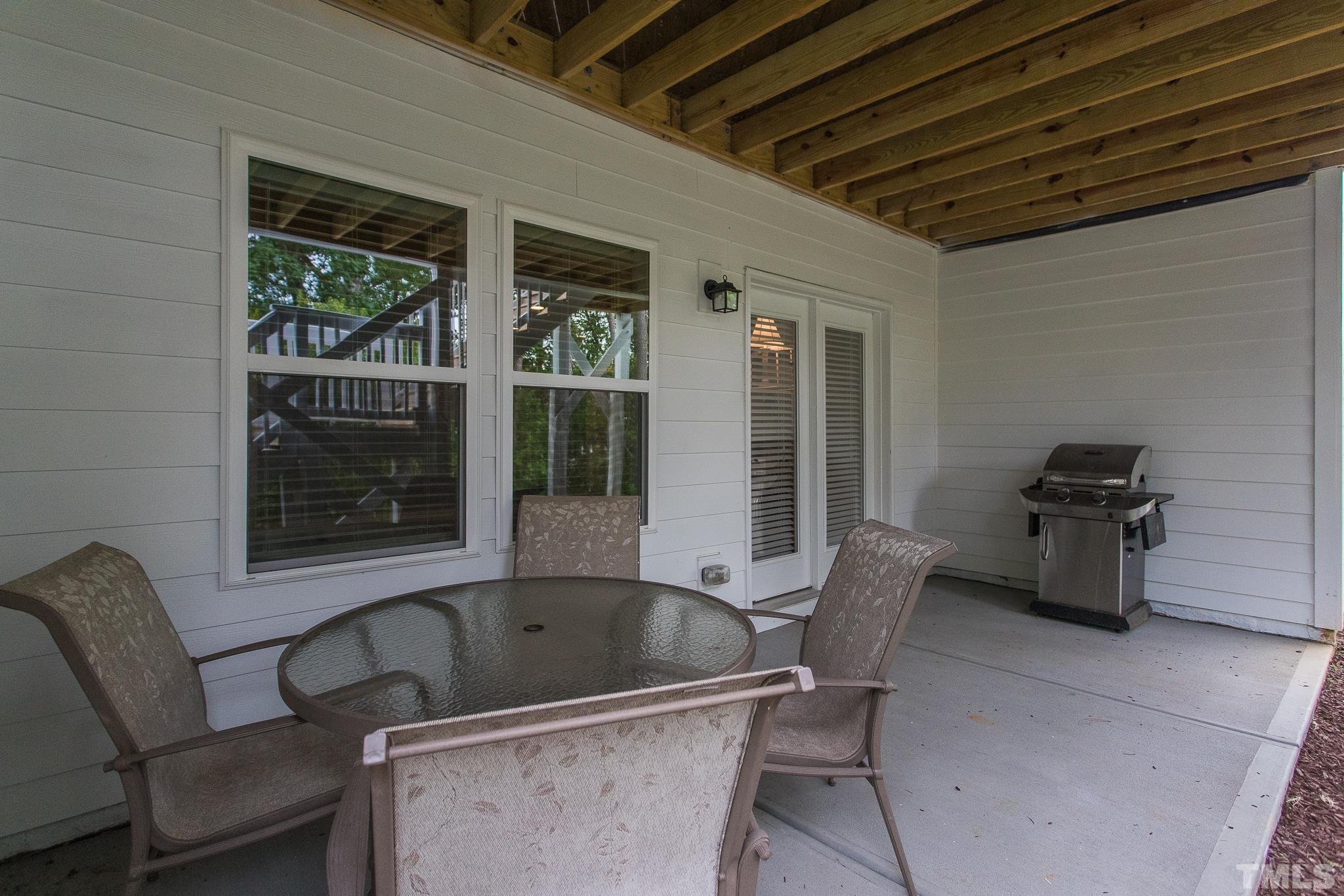 5281 Aleppo Lane Raleigh, NC 27613 - Photo 47 of 57 a view of a chairs and table in a patio