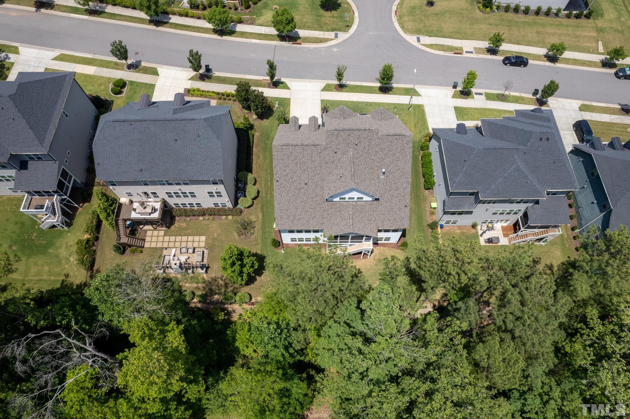 5281 Aleppo Lane Raleigh, NC 27613 - Photo 52 of 57 an aerial view of residential houses with outdoor space and parking