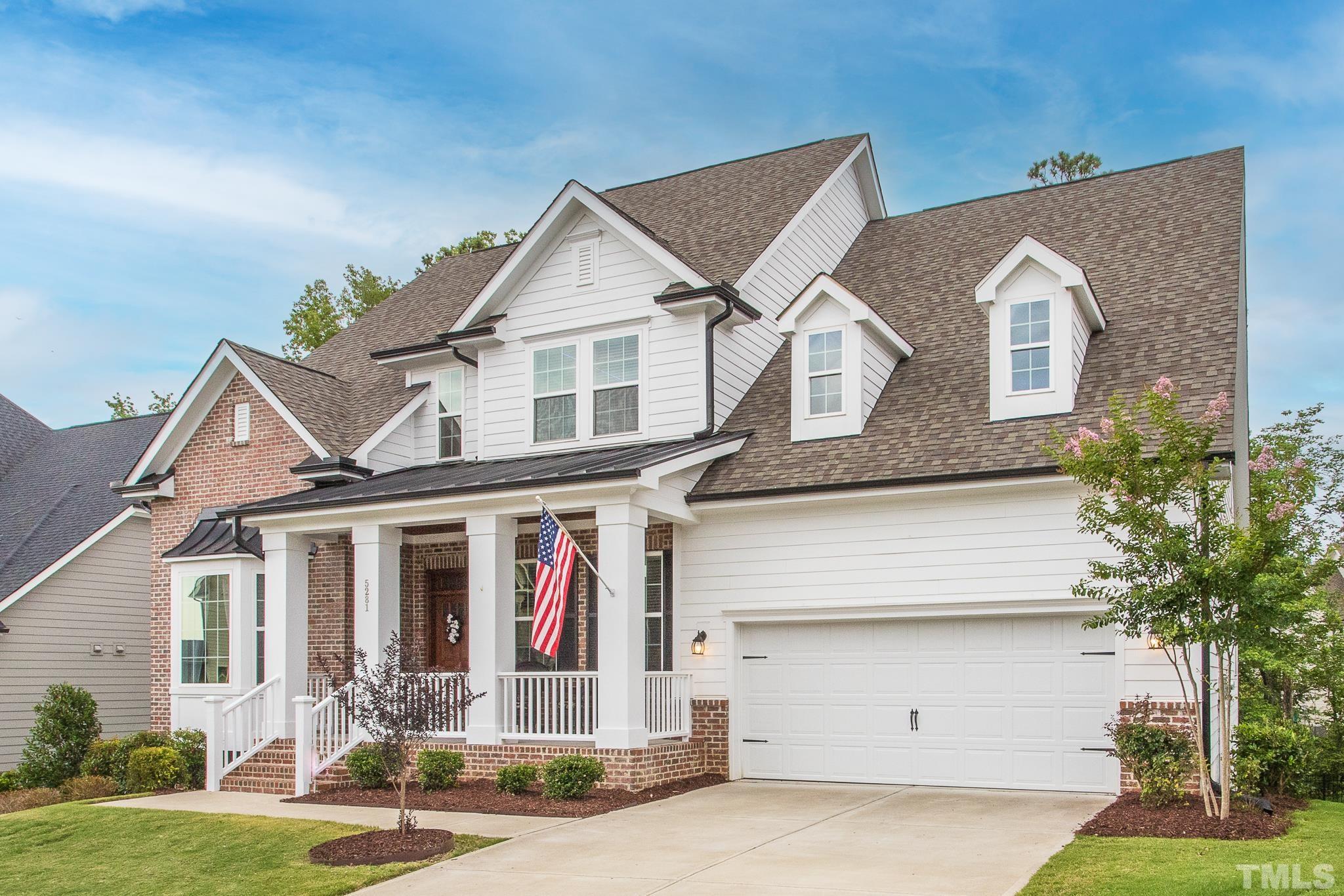 5281 Aleppo Lane Raleigh, NC 27613 - Photo 9 of 57 a front view of a house with a yard