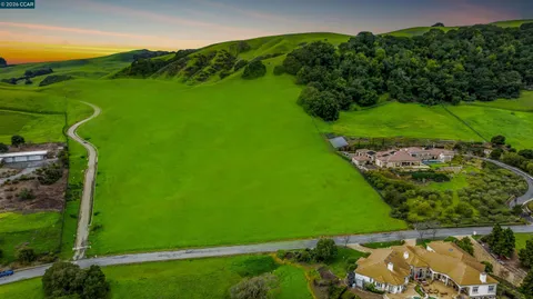 a view of a field with of houses