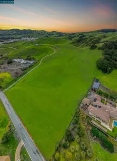 a view of a field with an outdoor space
