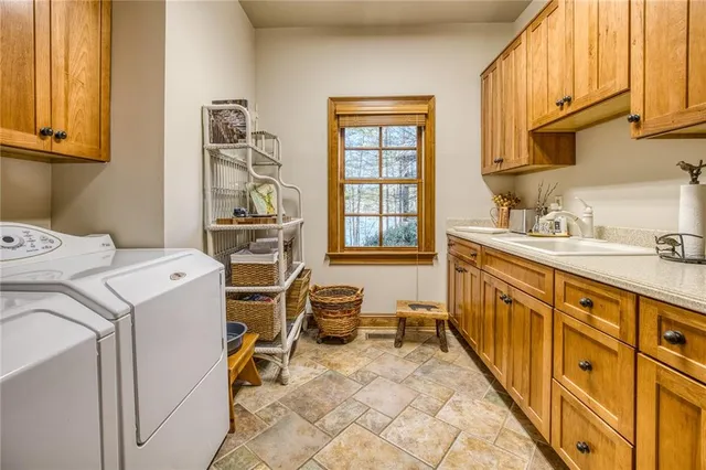 a spacious bedroom with a large bed and a dresser