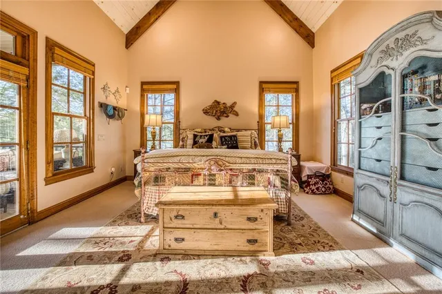 a living room with furniture a front door and a floor to ceiling window