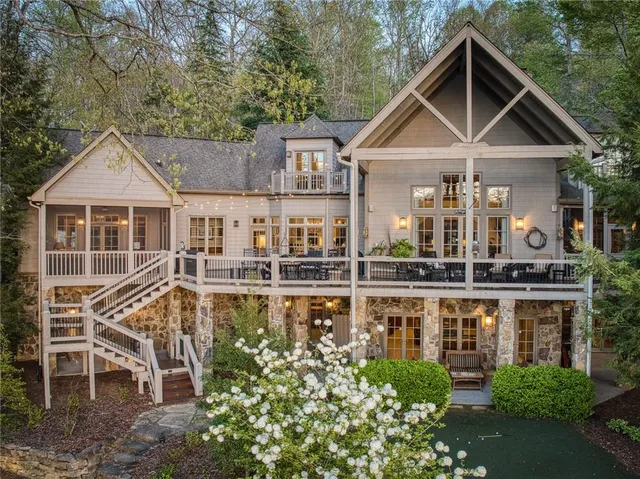 a front view of a house with a yard table and chairs