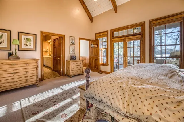 a spacious bathroom with a tub sink and mirror