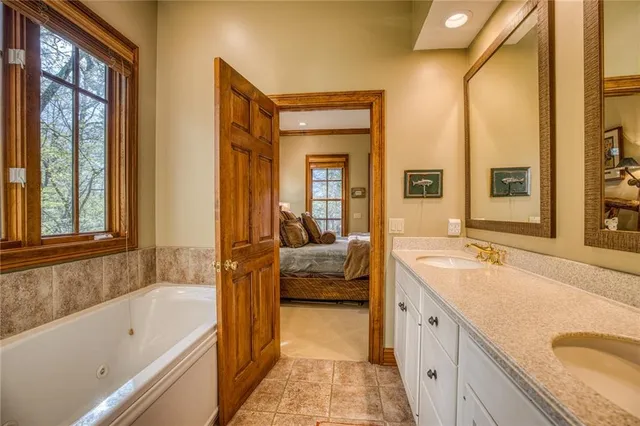 a living room with fireplace furniture and a window