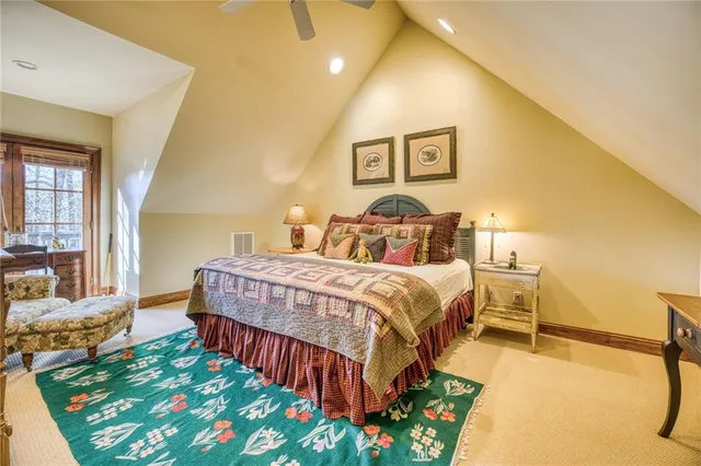 a view of a patio with table and chairs with wooden floor and fence