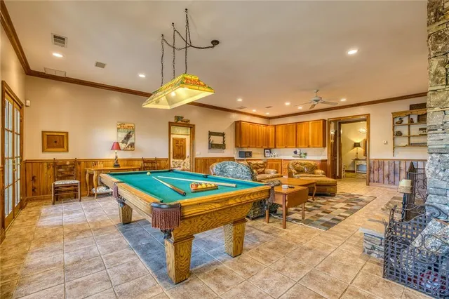a front view of a house with a yard and balcony