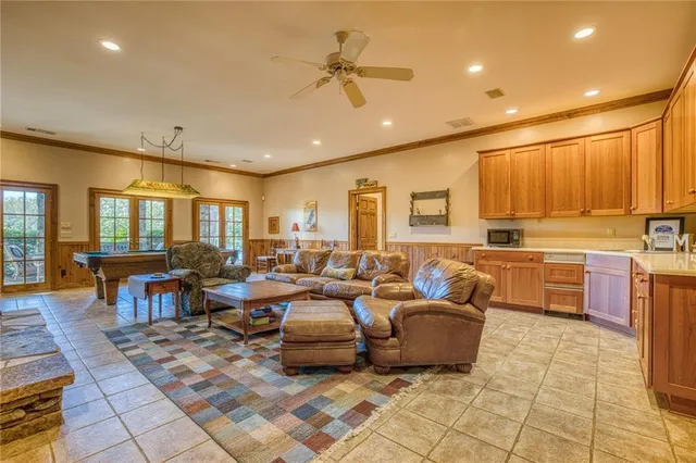 a view of a deck with couches table and chairs with wooden floor