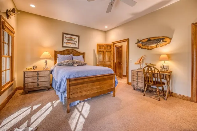 a roof deck with couches and wooden floor