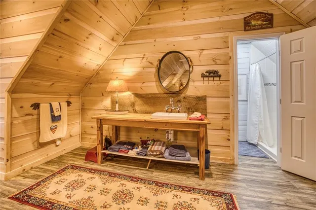 a view of a lake with chairs