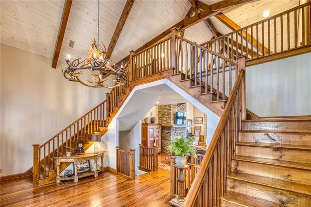 a living room filled with furniture hardwood floor and a table