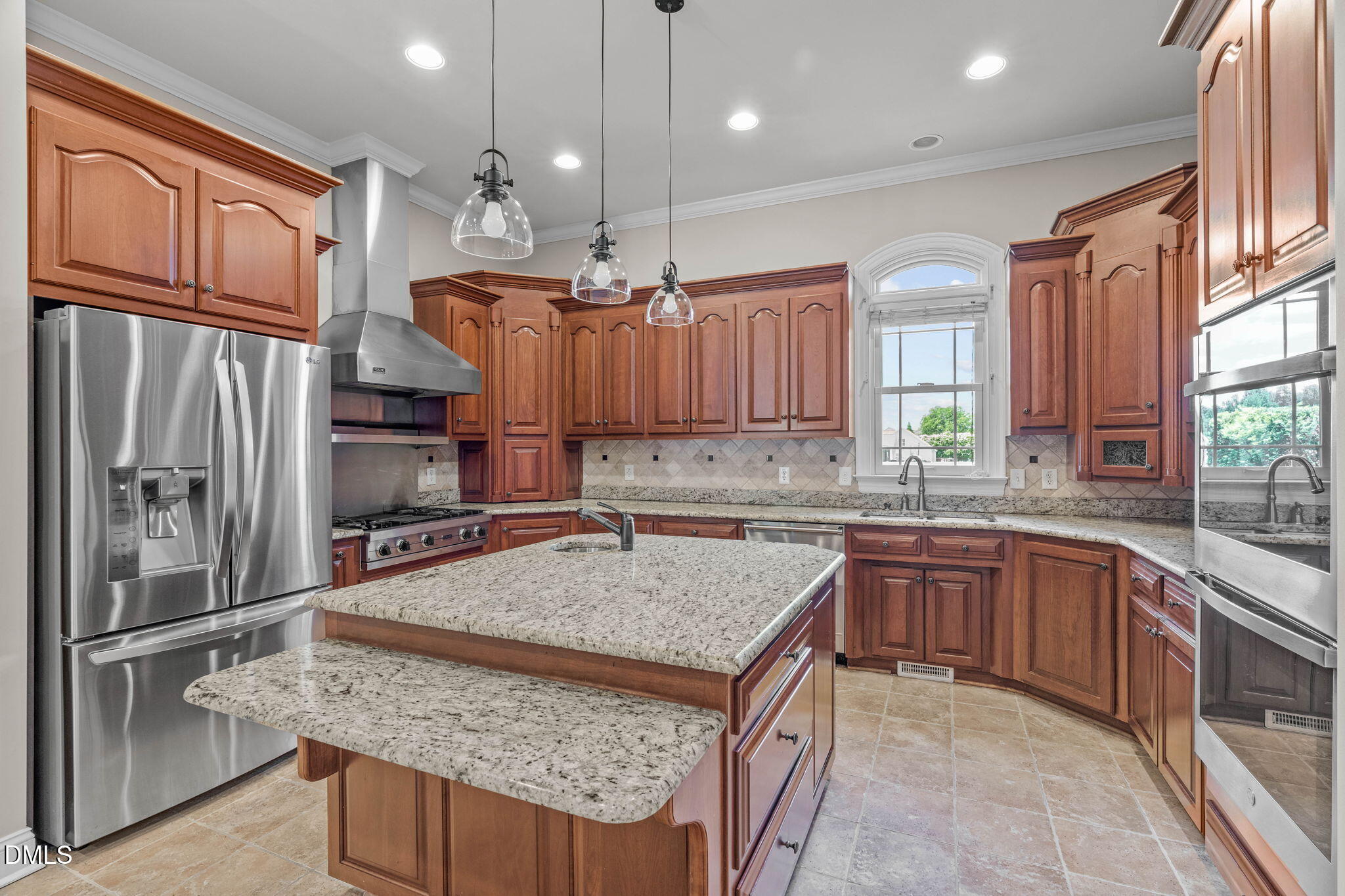 10917 Jordan Road Raleigh, NC 27603 - Photo 4 of 58 a kitchen with stainless steel appliances granite countertop a sink refrigerator and cabinets