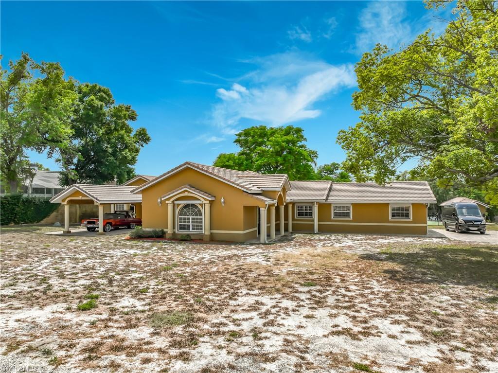 4210 South Hiawassee Road Orlando, FL 32835 - Photo 5 of 49 a front view of a house with a yard