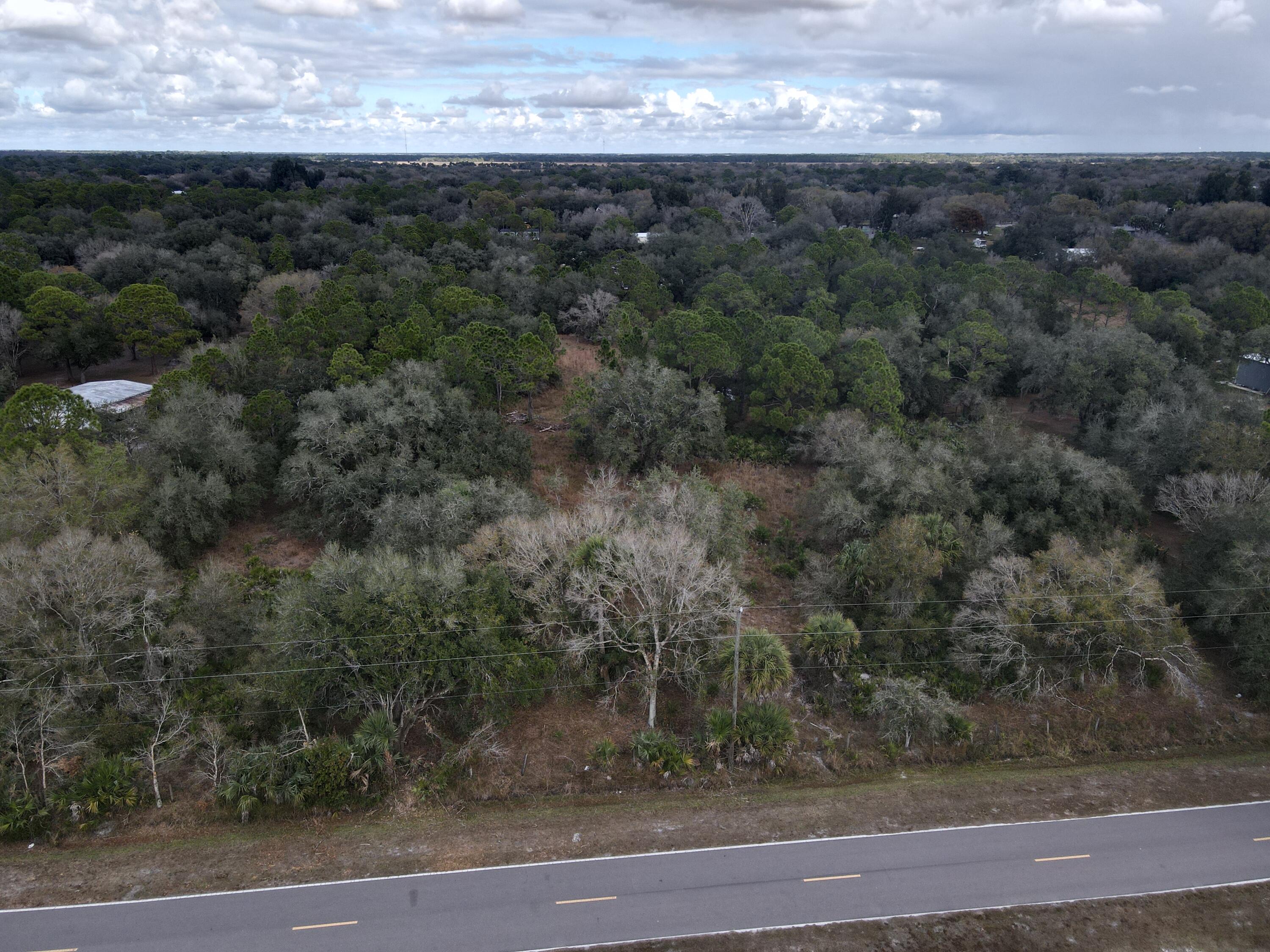 1245 Northwest 98th Street Okeechobee, FL 34972 - Photo 3 of 15 a view of a yard next to a yard
