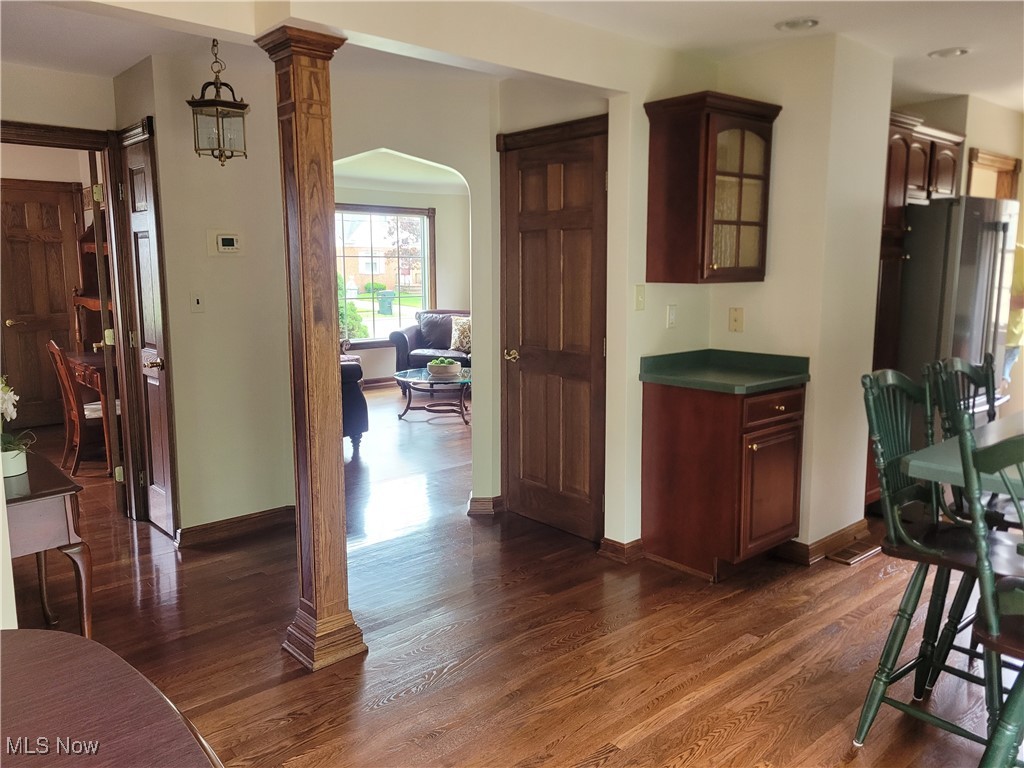 1372 Mayfield Ridge Road Cleveland, OH 44124 - Photo 6 of 37 Kitchen featuring hardwood floors, decorative oak column.