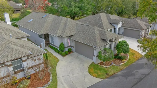 an aerial view of a house with a garden and plants