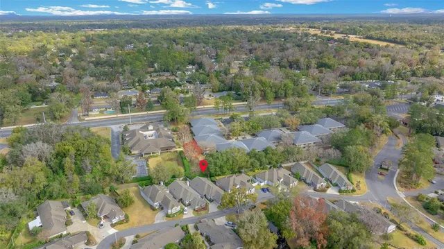 an aerial view of a house with outdoor space and street view