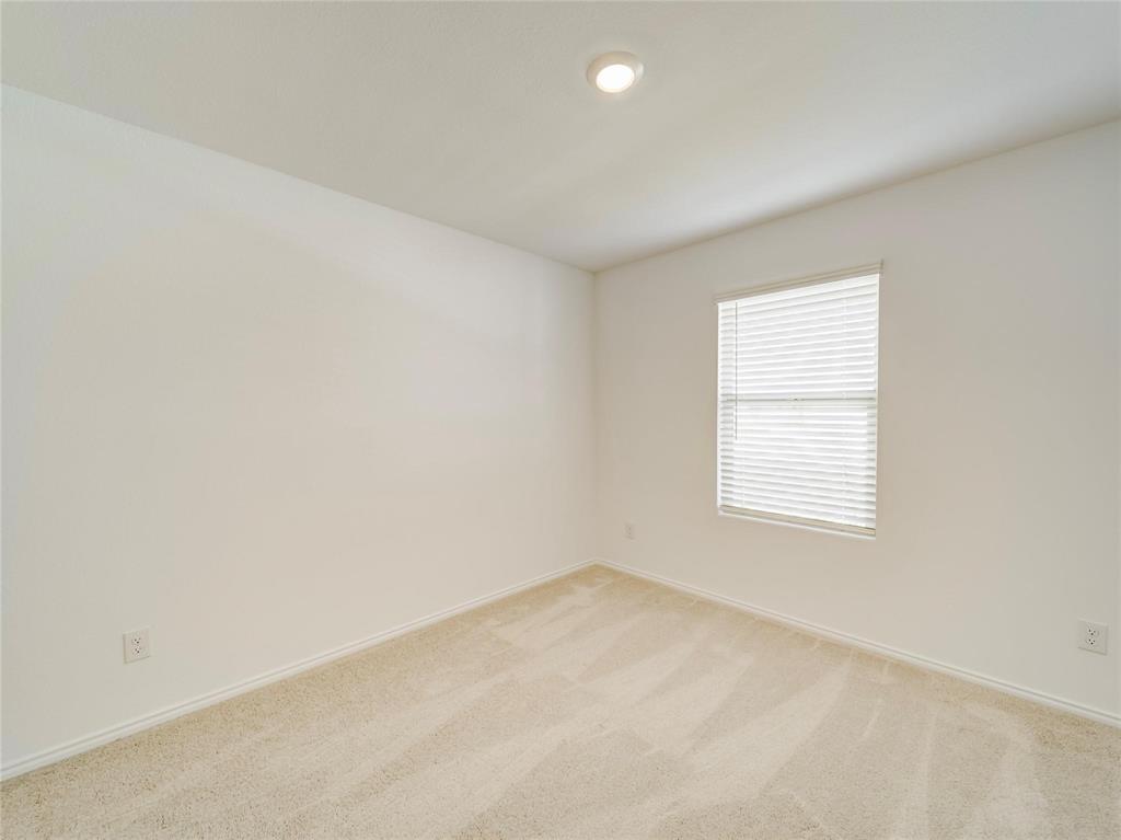 357 Sun Bluff Road Fort Worth, TX 76052 - Photo 30 of 35 Room featuring neutral carpeting, white baseboards, and a window with horizontal blinds