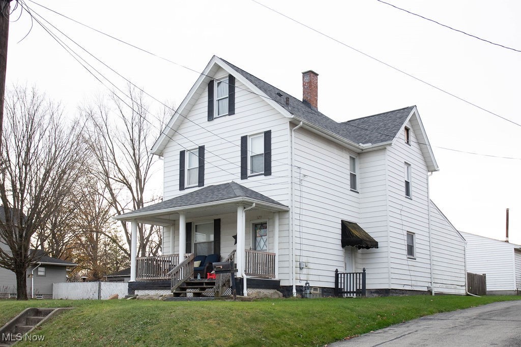 125 Ridgeway Street Struthers, OH 44471 - Photo 1 of 24 View of front of house featuring a front yard and covered porch