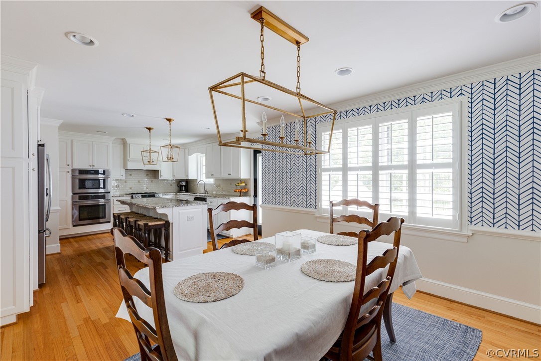 13331 Kingsmill Road Midlothian, VA 23113 - Photo 11 of 49 a view of a dining room with furniture and wooden floor