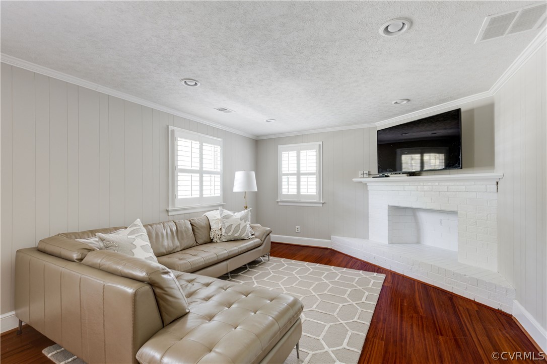 13331 Kingsmill Road Midlothian, VA 23113 - Photo 22 of 49 a living room with furniture and a flat screen tv