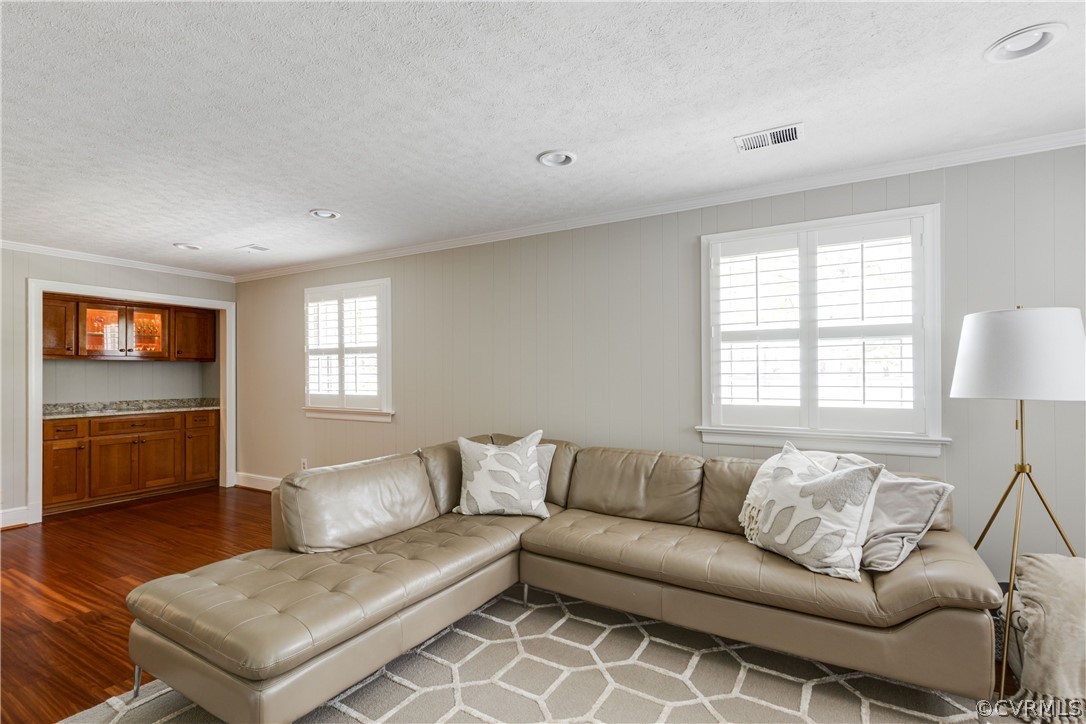 13331 Kingsmill Road Midlothian, VA 23113 - Photo 24 of 49 a living room with furniture and a flat screen tv