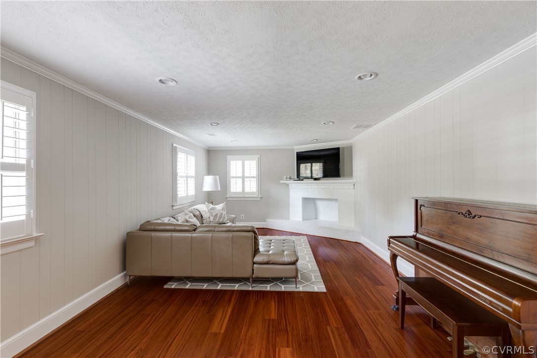 13331 Kingsmill Road Midlothian, VA 23113 - Photo 25 of 49 a living room with a couch and a flat screen tv