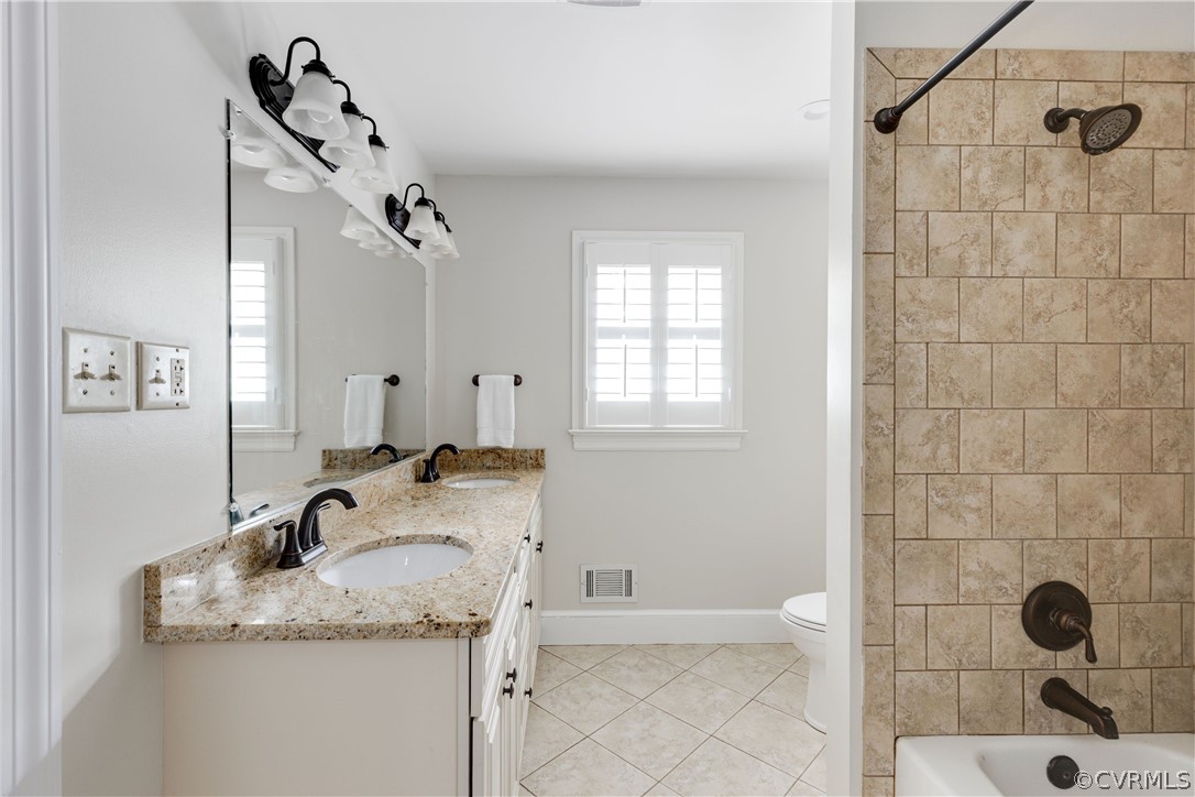13331 Kingsmill Road Midlothian, VA 23113 - Photo 34 of 49 a bathroom with a granite countertop sink a toilet and shower