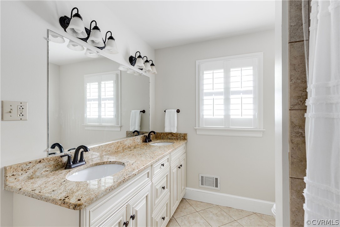 13331 Kingsmill Road Midlothian, VA 23113 - Photo 35 of 49 a bathroom with a granite countertop sink and a mirror