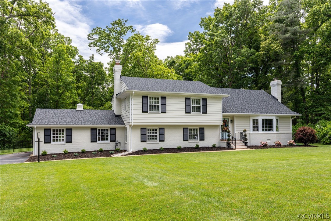 13331 Kingsmill Road Midlothian, VA 23113 - Photo 49 of 49 a front view of a house with a garden