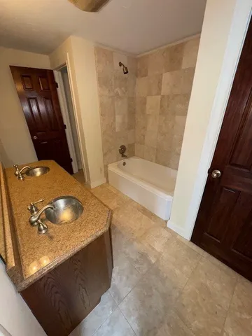 a bathroom with a sink a toilet and mirror