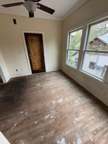 a view of a porch with wooden floor