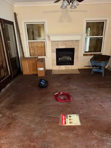 a living room with furniture and a fireplace