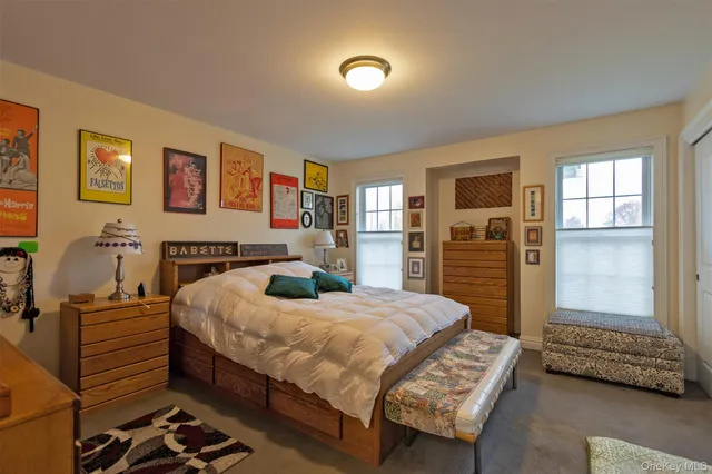 a bedroom with a bed and dresser