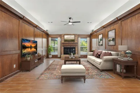 a bedroom with a large bed and a painting on the wall