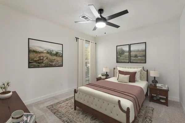 a bedroom with a bed and a flat tv screen on wall