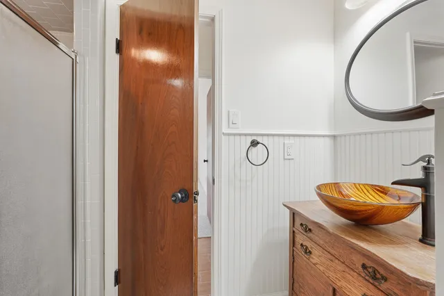 a bathroom with a sink double vanity and a mirror