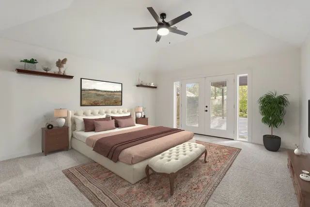 an empty room with windows and ceiling fan