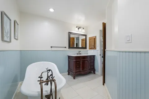 a kitchen with granite countertop wooden cabinets a sink and dishwasher