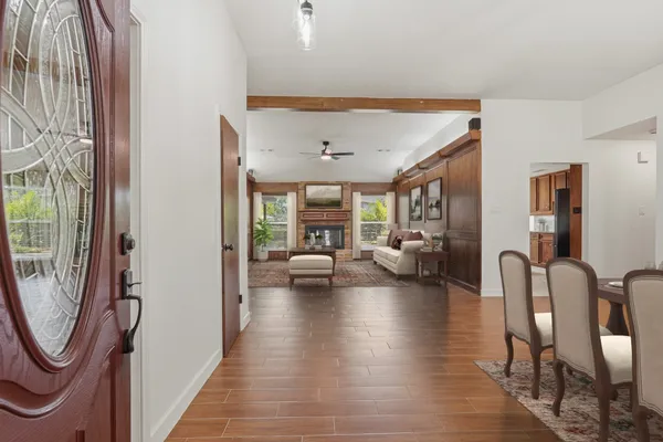 wooden floor in an empty room with a window